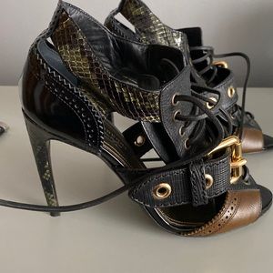Burberry shoes. Real python skin. Brown with olive green. Black background.